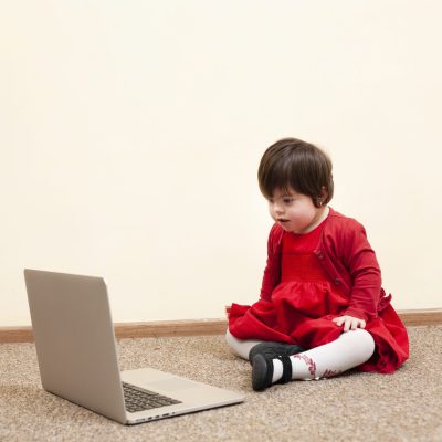 child-with-down-syndrome-looking-laptop